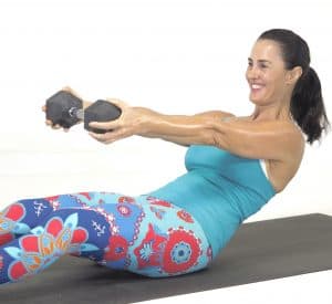 Corestrength50plus dumbbell ab exercise on the mat