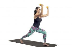 Power yoga warrior move with DBs for women over 50