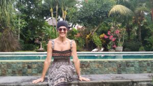 sitting by pool what you focus on expands Elaine Reynolds Master Personal Trainer