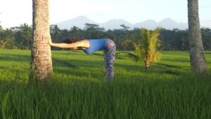 Why stretch after a workout....yoga pose against palm tree